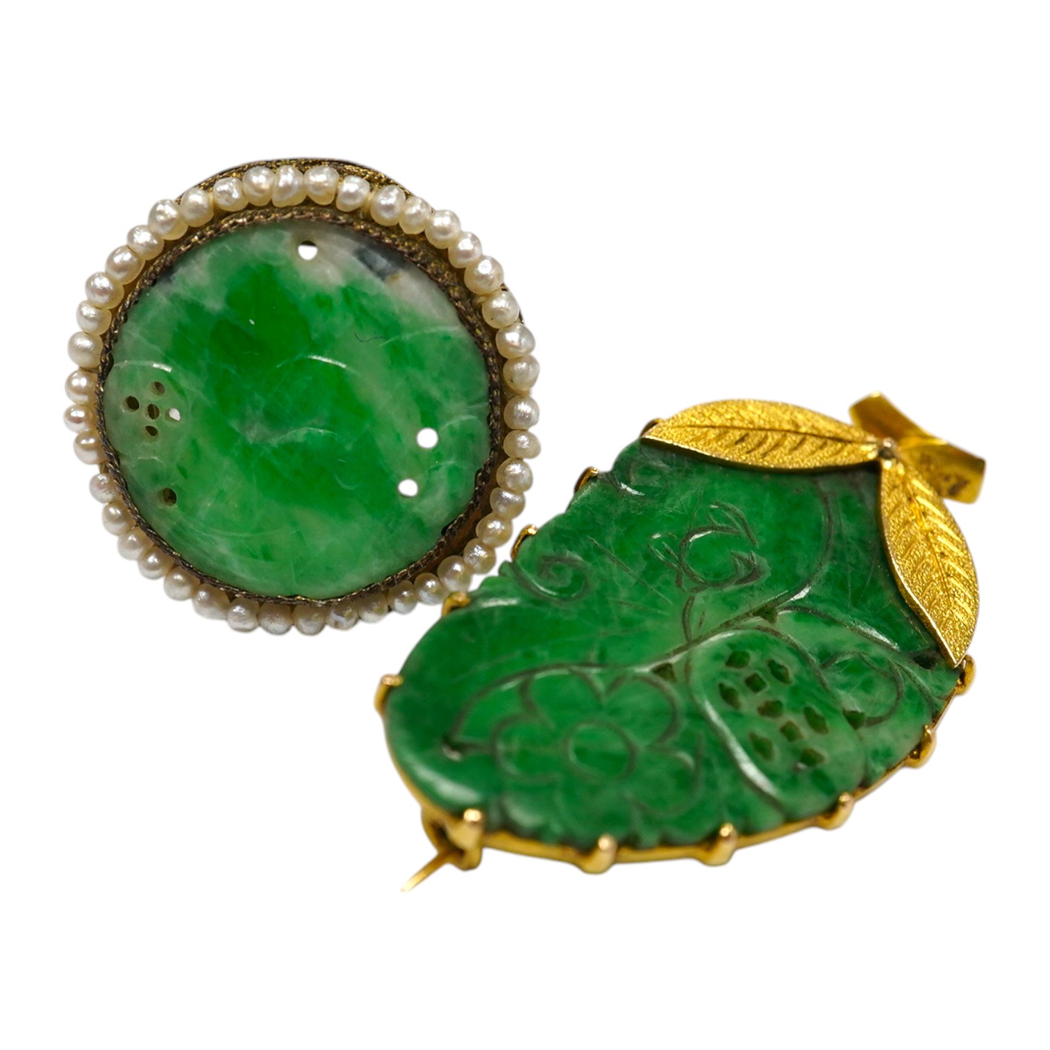 A Chinese yellow metal mounted carved jade leaf brooch, stamped 'TC18', 36mm, gross weight 5.6 grams and a jade and seed pearl set filigree ring. Condition - fair to good